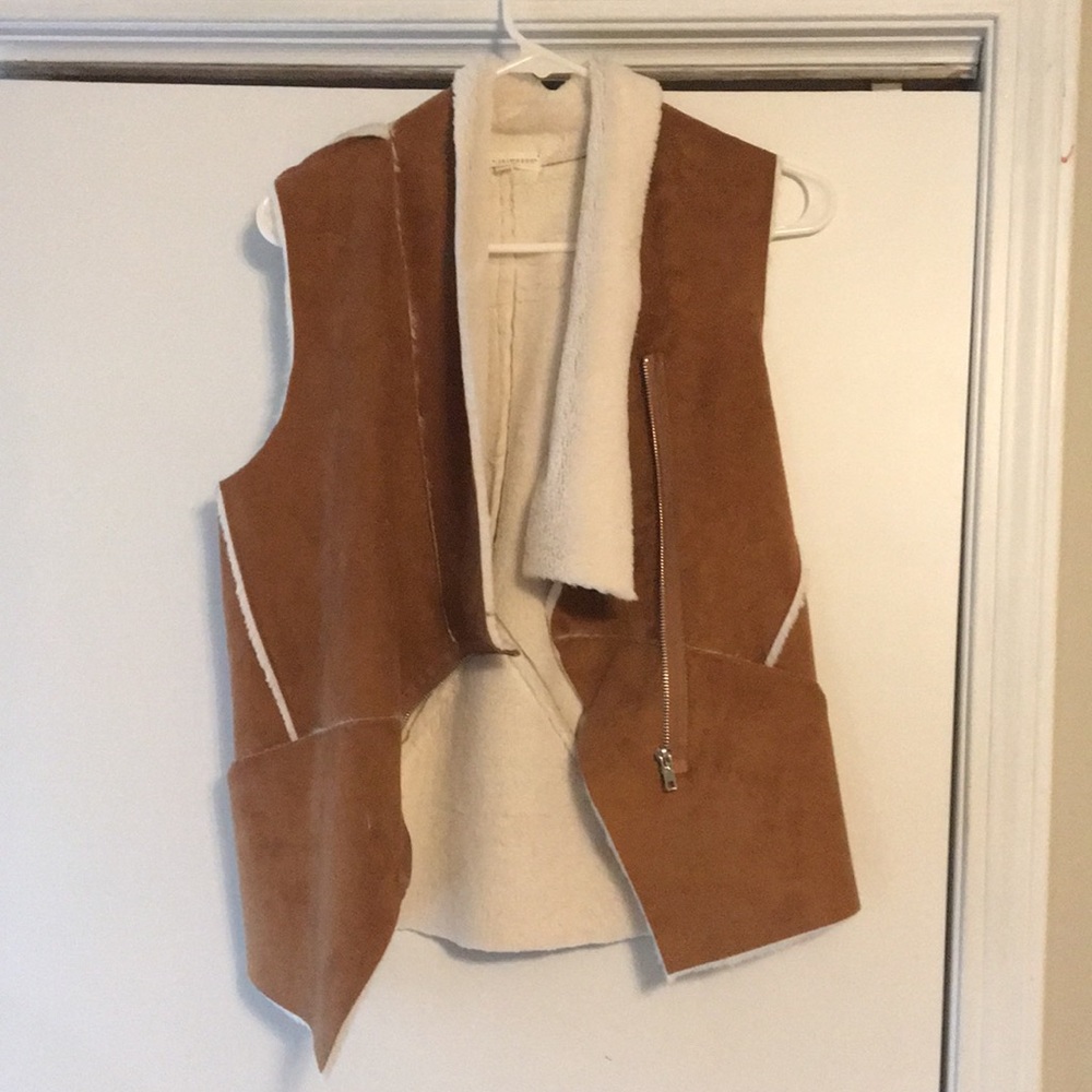 Tan vest, worn little and in good shape
